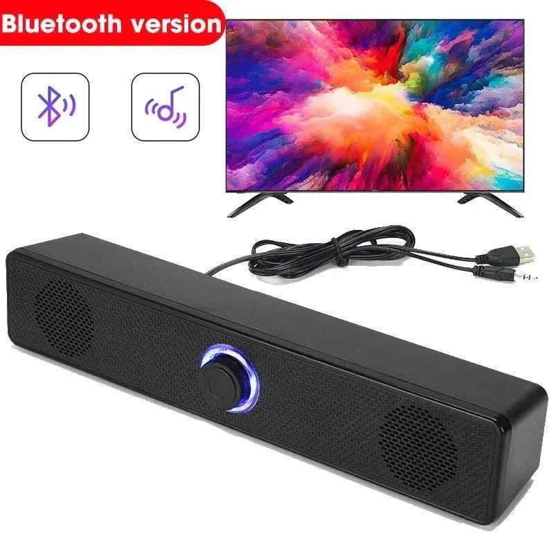 Compact black bluetooth wired speaker with control buttons and aux cable attached